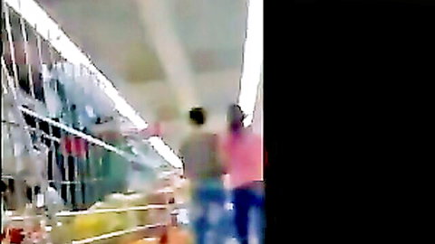 Candid upskirt of two Filipina women showing asses in supermarket aisle