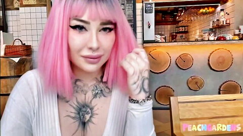 Pink-haired Russian bimbo in public toilet, cleavage and tattoos