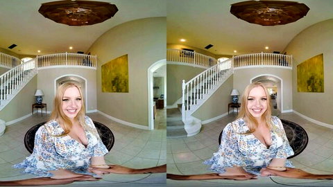 Smiling blonde housewife with big tits teasing cleavage in floral dress luxury home VR POV