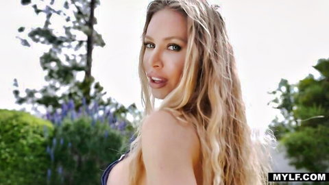 Nicole Aniston in sexy black lingerie posing outdoors, blonde bombshell tease