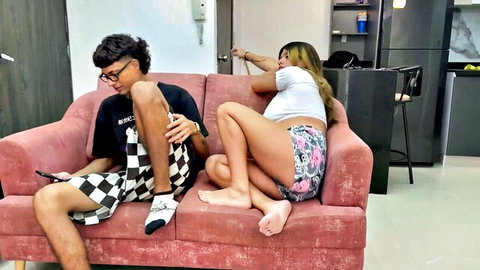 Slutty Asian stepsister teases porn-addicted stepbro on couch in shorts