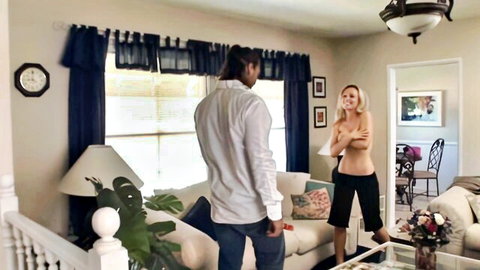Topless blonde babysitter confronted by man in living room scene