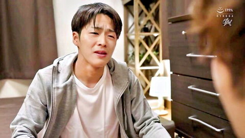 Yuu Shinoda JAV scene: emotional Asian man in hoodie, intimate bedroom moment