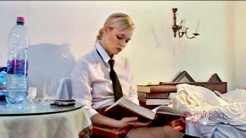 Blonde Russian schoolgirl in uniform reading book seductively