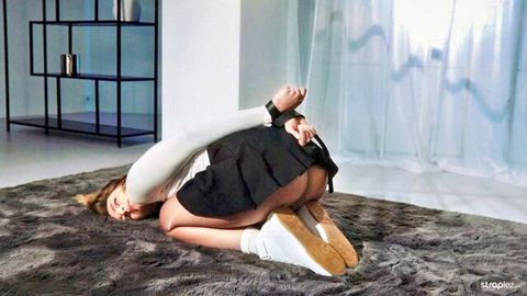 Bound petite blonde with wrists cuffed behind back skirt up exposing juicy ass cheeks on shag rug