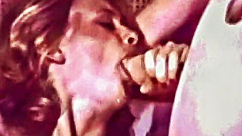 Vintage blonde retro pornstar giving deep blowjob in classic XXX scene