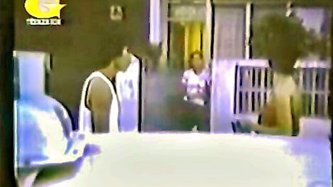 Vintage 1980 prison scene with Angela, black woman in white top among inmates