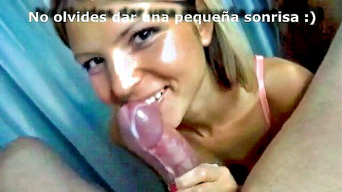 Smiling blonde woman teases with pink dildo in mouth, oral fun