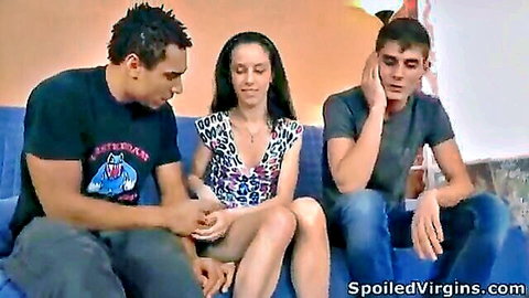 Virgin Stella sits between two men on couch in teasing threesome preview