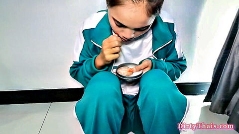 Thai girl Cherry in Squid Game tracksuit eating seductively
