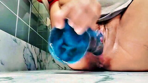 Pregnant woman inserting blue dildo vaginally, close-up solo masturbation