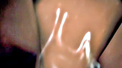Fingers spreading shaved wet pussy lips closeup in black thigh-high stockings