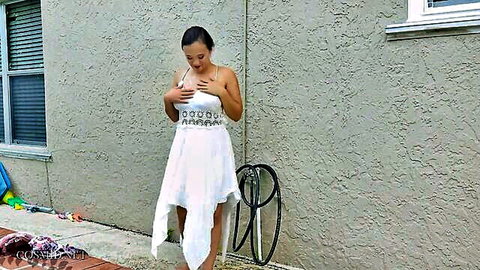 Roxy Bloom in sexy white dress teasing her breasts outdoors