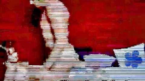 Blurry nude white amateur girl arching back on red bed showing pale ass cheeks