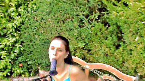 Skinny brunette teen sucks purple dildo deep in mouth outdoors in bikini top