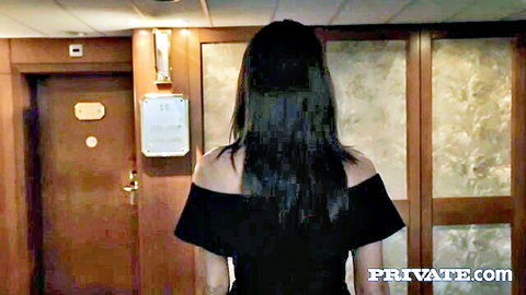Vanessa Decker in sexy black off-shoulder dress, long brunette hair, teasing pose