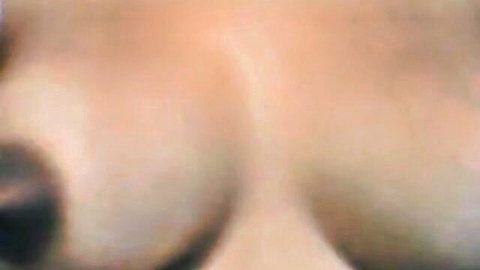 Nycoly close-up of large pale breasts, topless tease