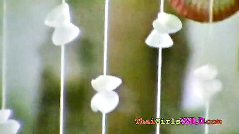 Beaded white shell curtains hanging in Thai room on ThaiGirlsWild.com