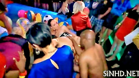 Woman with wet exposed pussy fucked by black man at crowded wet body pool orgy party