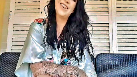 Harmony Reigns BBW in silky floral robe, smiling seductively