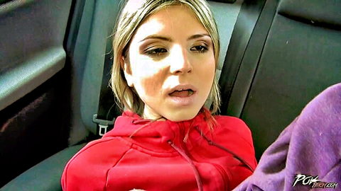 POV closeup of young blonde in red hoodie with open mouth in car