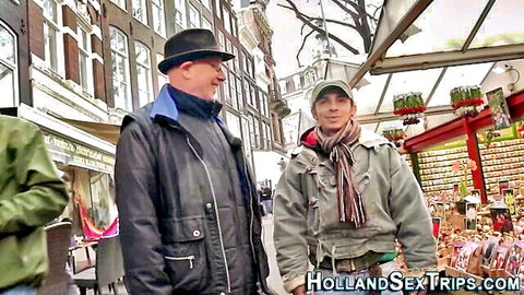 Two men on Holland sex trip strolling Amsterdam streets near market