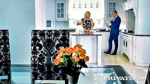 Brittany Bardot blonde MILF in floral dress teasing in kitchen