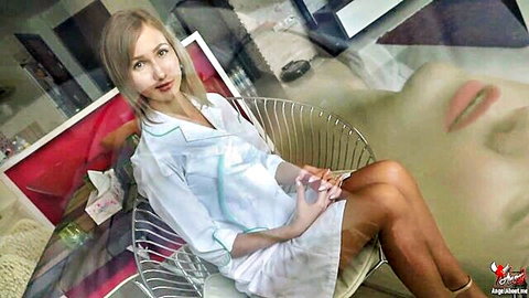 Angel The Dreamgirl as seductive bad nurse in short uniform, legs crossed