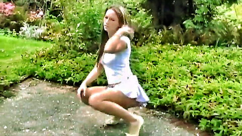 Kate squatting in short white skirt, teasing outdoor upskirt view