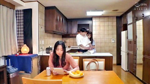 Rima Arai as sister in casual kitchen scene, tablet in hand