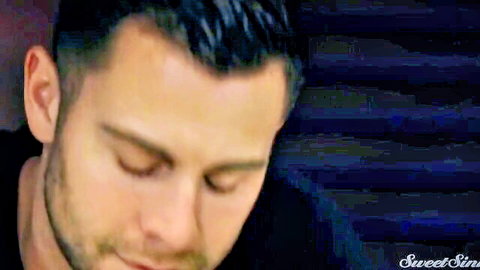 Closeup of handsome man's face in intense ecstasy with eyes closed and stubble beard