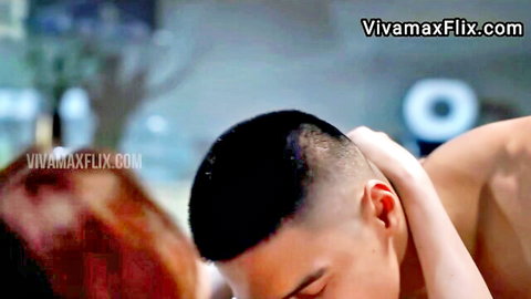 Asian buzz-cut man gripped by woman's hand in steamy Elevator Lady scene