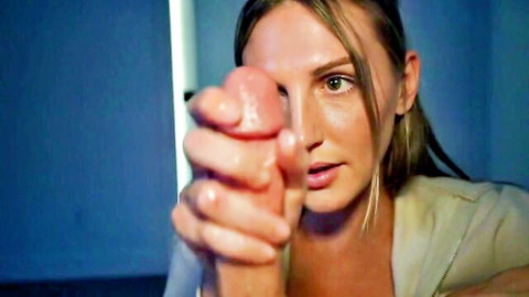 Blonde woman in suit holding big cock close to her face in teasing POV