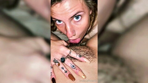 Indica Flower tongue out near hairy cock in hippie blowjob scene