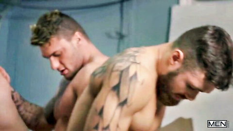 Two muscular men in intense gay anal sex, tattoos and beards visible
