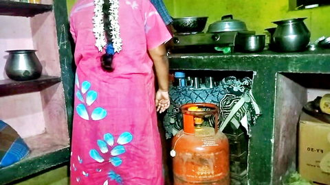 Indian village girl in pink dress with braid in kitchen for doggy style
