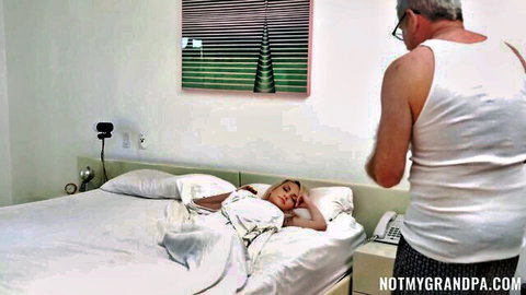 Older man watches sleeping young blonde step-granddaughter in bed
