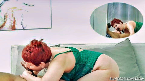 Redhead in green lingerie sucking BBC passionately
