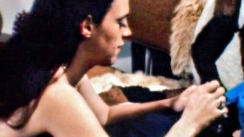 Vintage 1971 brunette woman topless in intimate couple scene from Johnny Wadd