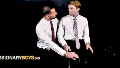 Bearded gay boss in suit touches young interviewee's thigh during tense office seduction