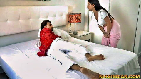 Curvy Indian babe in white top and pink saree teases lying South Asian guy on bed