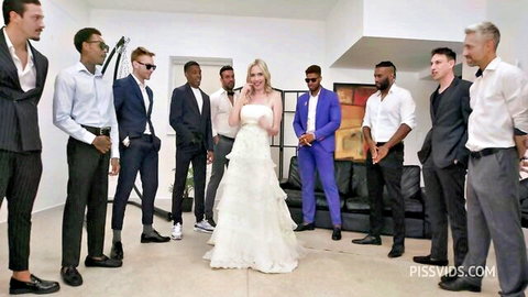 Rebel Rhyder in wedding dress surrounded by diverse men for interracial gangbang