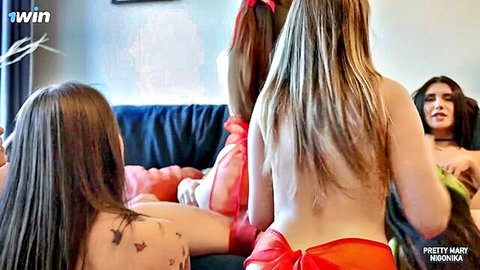 Topless college girls with long hair and tattoos tease bare backs and asses in thongs on dorm couch