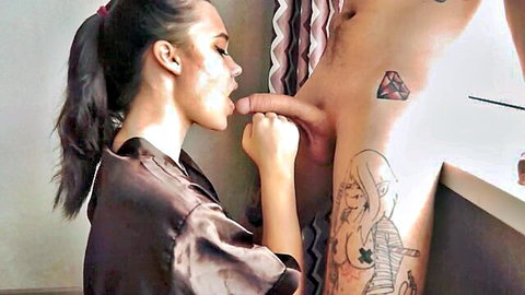 Kate Koss kneeling blowjob on tattooed man in silk robe
