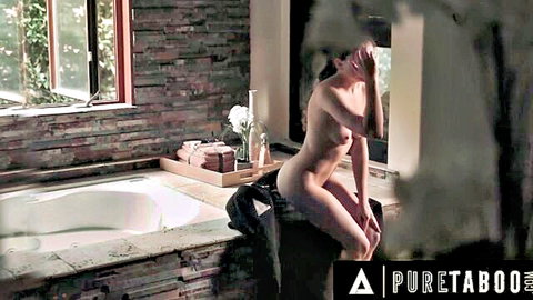 Skinny brunette with small tits sits nude on bathtub edge spreading legs exposing shaved pussy