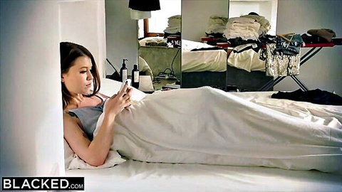 Misha Cross, Polish beauty in tank top, lounging seductively on bed holding phone