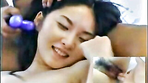 Smiling Japanese brunette with fair skin teased by purple vibrator on her lips