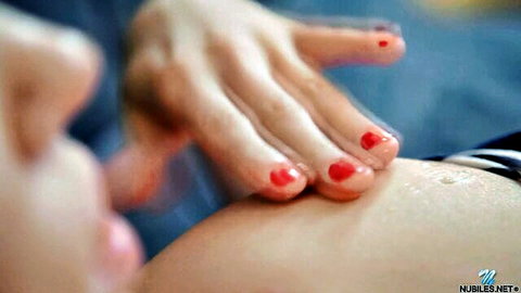 Pregnant Julie Vee sensually touching her belly close-up