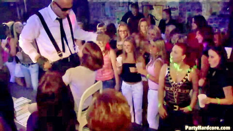 Wild party with suited guy surrounded by scantily clad blondes and brunettes