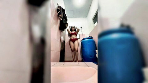 Indonesian Rita in red bikini posing seductively in bathroom